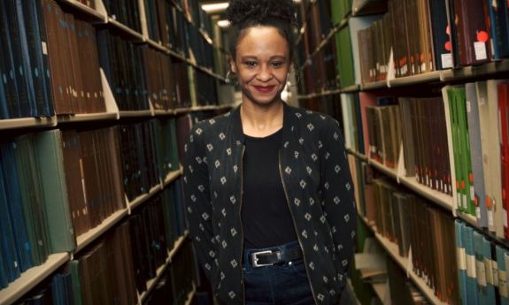 Tracie Canada in the library stacks