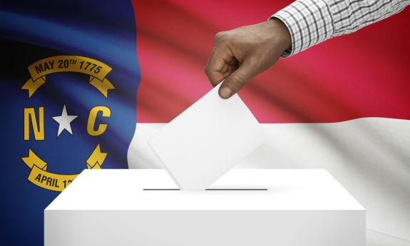 graphic image of a ballot being cast in front of the NC state flag