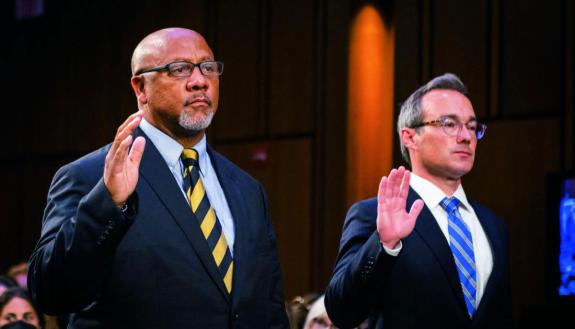 Philip Smith, founder and president of the national African American Gun Association, left, and Duke Law professor Joseph Blocher are sworn in during a Senate Judiciary Committee hearing to examine the Highland Park attack. Photo by Rod Lamkey