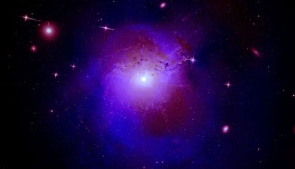 Dark matter, the invisible stuff that makes up 85% of the Universe’s matter, isn’t just hidden away between galaxies. A team of scientists is trying to bring it out of the shadows. (X-ray: NASA/CXO/Fabian et al.; Radio: Gendron-Marsolais et al.; NRAO/AUI/NSF Optical: NASA, SDSS)
