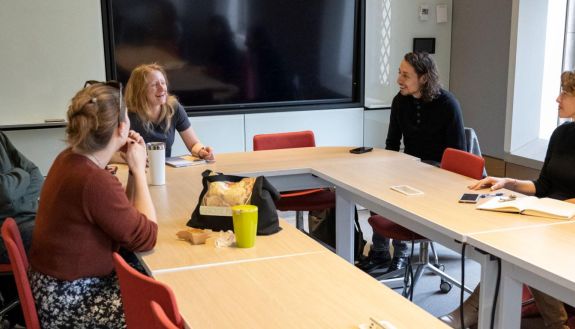 Graduate students share thoughts in discussion in peer mentoring program for first-years