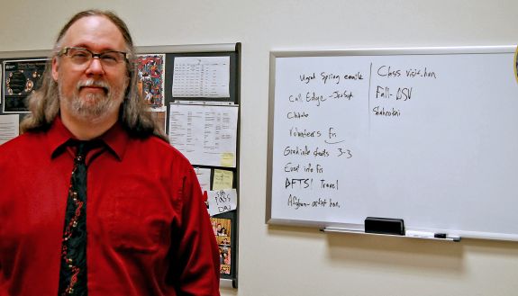 Jeremy Boomhower uses a white board to track his to-do list. Photo by Jack Frederick.