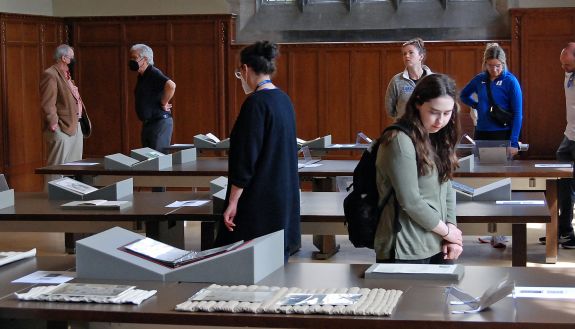 Attendees for "I Got a Story to Tell: Black Voices in Print" in the Gothic Reading Room look through materials on display. Photo by Jack Frederick.