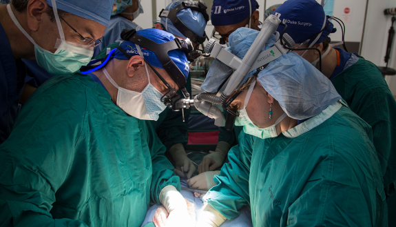 Surgeon Debra Sudan, MD, (at right, seen here doing a surgical procedure at Duke) traveled to Singapore to perform groundbreaking intestinal transplants.