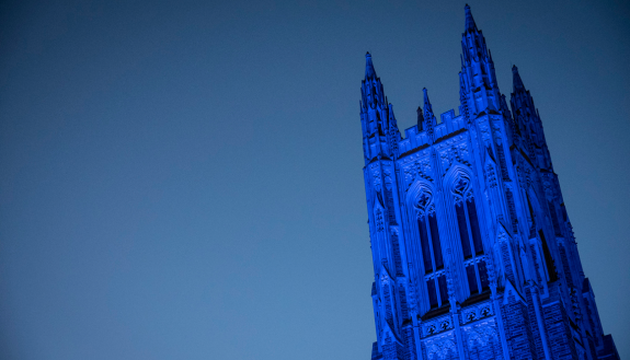 top of Duke Chapel lit blue