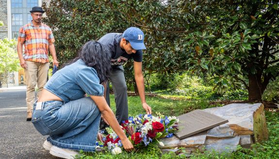 Tara Singh, President of Keohane Quad Council and class of 2026 and Ranjan Jindal, Vice-President of Keohane Quad Council and class of 2026, lay a wreath on the plaque near the grove of six trees planted