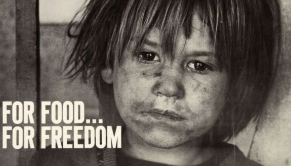 SNCC digital archive photo of hungry child. Text: For Food... For Freedom