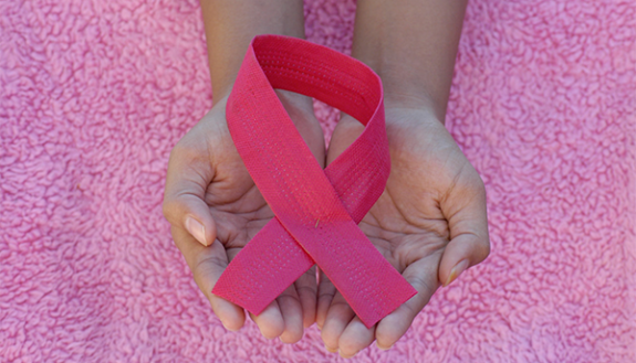 stock footage of hands holding breast cancer ribbon