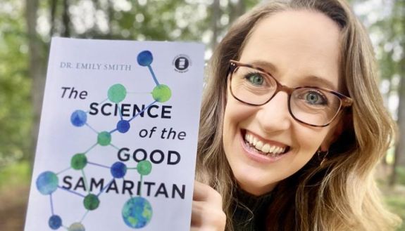 Emily Smith with her book The Science of the Good Samaritan