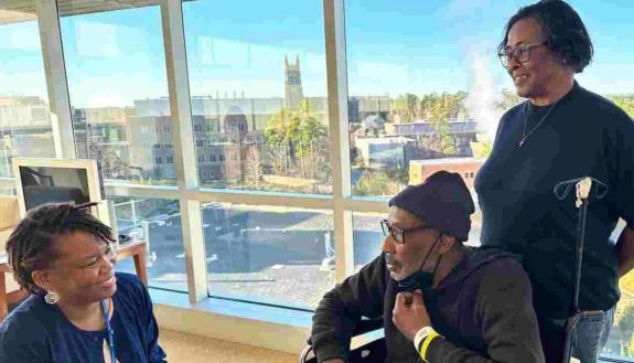 Duke patient navigator Melody McNair, RN, talks to Mr. Fogg and his sister, Sherry Williams.