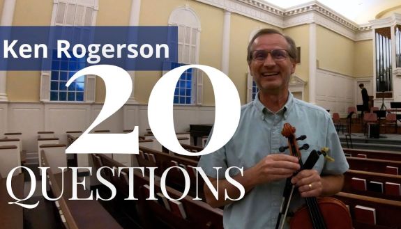 Ken Rogerson holding a viola for 20 Questions video thumbnail