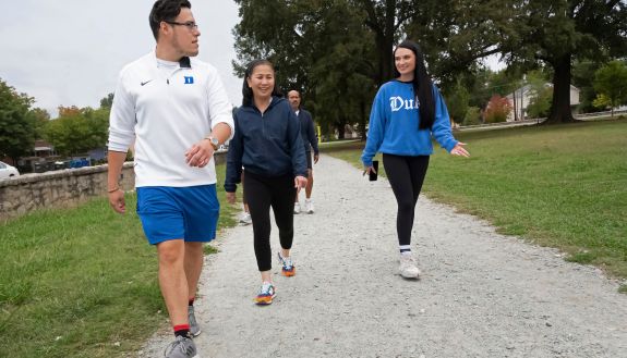 Duke employees walk on a path during the Duke Run/Walk Club