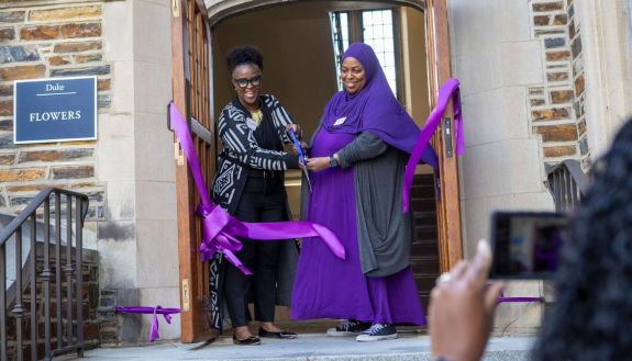 Stacia Solomon, director of the Mary Lou Williams Center, and Samaiyah Faison, assistant director, cut the ribbon during the reopening event for the Mary Lou Williams Center for Black Culture.