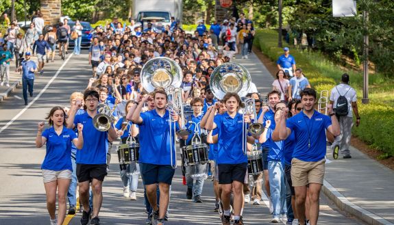 Members of the Duke Marching Band lead first-year students down Chapel Drive during the Bricks to Stone event. Photo by Bill Snead