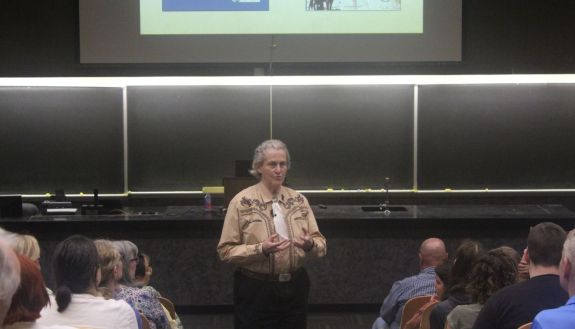 Temple Grandin at the front of a lecture hall