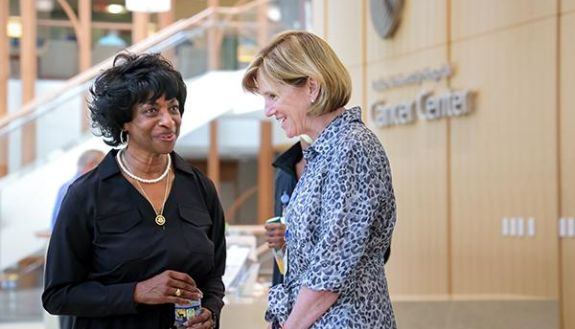 Congresswoman Valerie Foushee, left, talks with Mary Klotman, MD, executive vice president for health affairs at Duke University