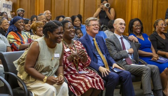 Wall family members Vanessa Wall Smart and Stephanie Joy Tisdale sit with President Vincent Price, Trustee Chair Adam Silver and Vice President Stelfanie Williams at the Wall Family Center dedication.