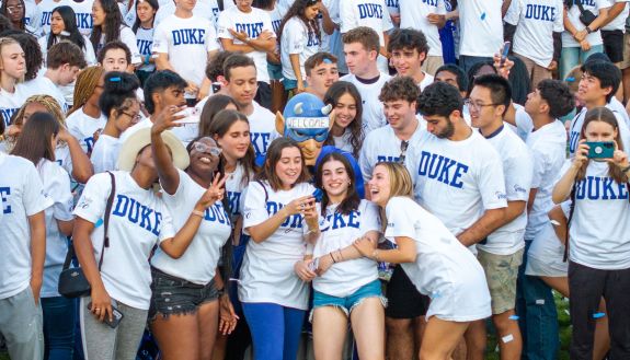 The Class of 2028 celebrates with the Blue Devil mascot at its class photo