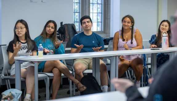 Students in the ASL course practice their sign language. 