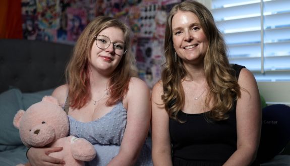 Duke University Grants and Contracts Administrator Anna Gibson, right, found security in her medical coverage when her daughter, Audrey, needed a heart transplant last year. Photo by Travis Stanley.