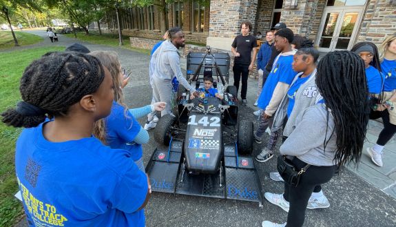 Students check out a race car during Duke-Durham School Days.