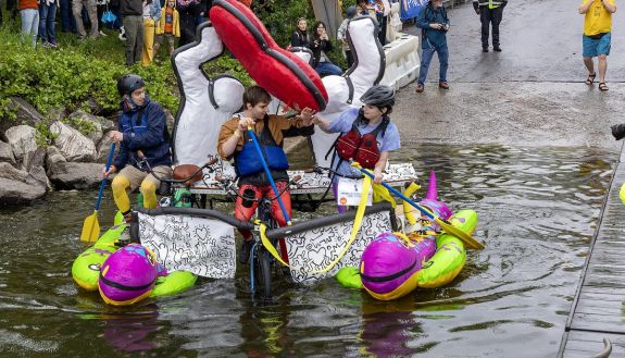 people on a contraption in the water