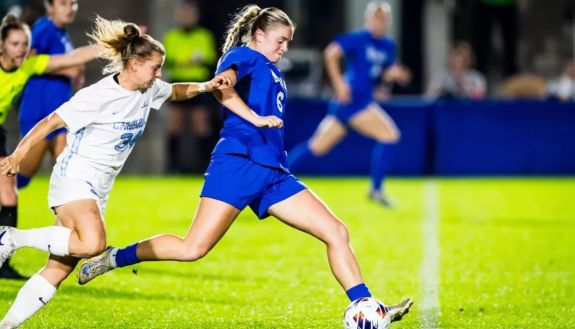 Duke women's soccer players on the field