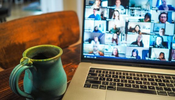 A coffee mug and a laptop.