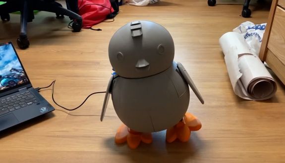 a little robot walking on the floor