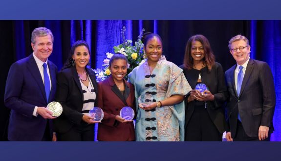 Award winners: Former NC Gov. Roy Cooper, Marissa Young, Jasmin Riley, Eni Owoeye, Thavolia Glymph and President Vince Price