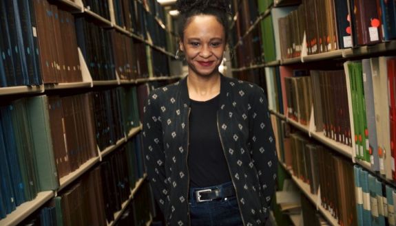 Tracie Canada in the library stacks