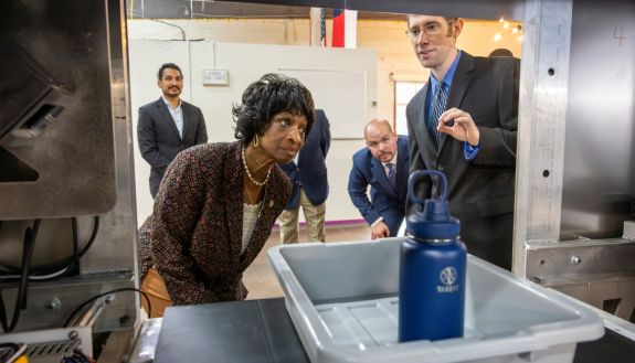 Woman looking into airport X-Ray scanner