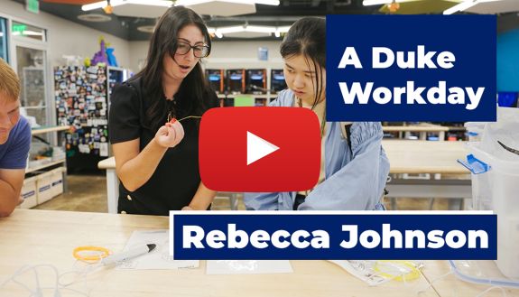 Rebecca Johnson, Program Coordinator for the Duke Innovation Co-Lab, shows a student how to use a piece of equipment.