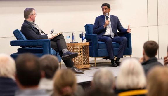 two people on a stage talking