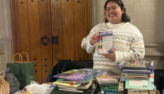 Person holding up a book