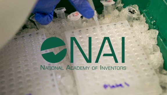 NAI logo over background of close up pipette work in a lab.