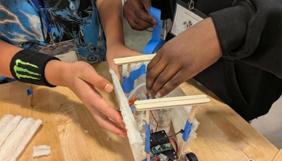 Shot of hands building something on a table