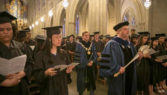 Academic Council Chair Don Taylor leads President Vincent Price in the baccalaureate procession Friday. Photo by Jared Lazarus