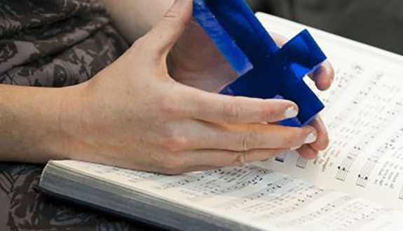 glass cross made by Statesville Glass Company, given to all Divinity graduates