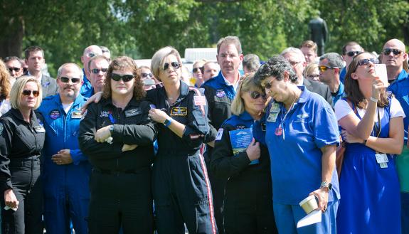 Duke community members and area first responders take a moment before the memorial service Wednesday. Photo by Jared Lazarus/Duke Photography