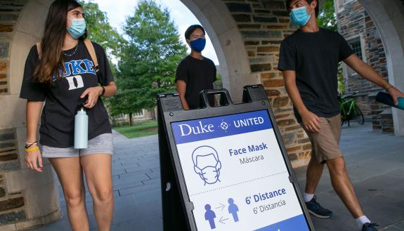 During the pandemic, masked students walk through the Bryan Center Plaza. In his book, Robert Bliwise explores student struggles and successes in pivoting to distanced learning and social life.