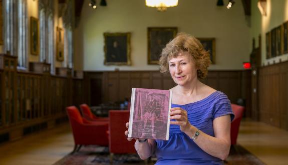 A protrait of Duke professor Helen Solterer holding her book “James Joyce Remembered”
