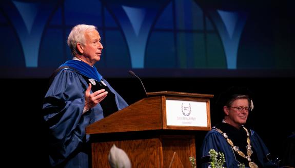 Duke President Emeritus Richard Brodhead speaks at DKU commencement.