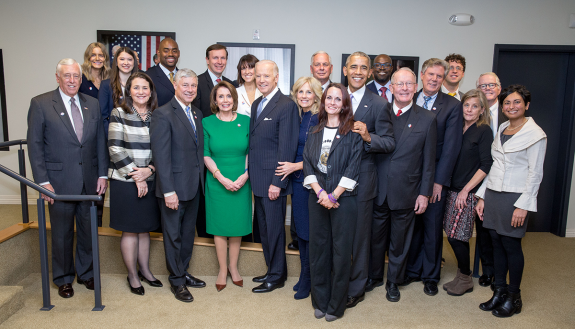 Kafui joined President Barack H. Obama and bipartisan congressional leadership for the signing of the 21st Century Cures Act on December 13, 2016. He is pictured betwee