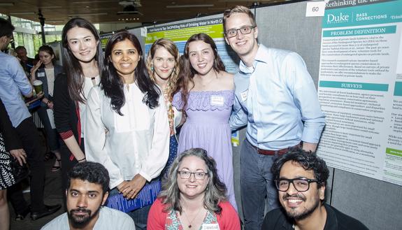 Kathleen Burns, center, top row, and other members of the DECIPHER Bass Connections team at a recent showcase