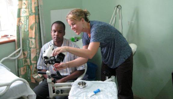Megan Huchko trains a clinical officer in Kisumu, Kenya, in colposcopy and other low-cost cervical cancer screening strategies.