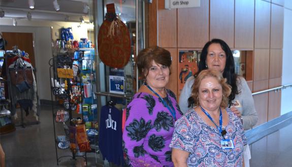 Duke Medicine Pavilion Gift Shop Supervisor Becky Riddle, Cashier Francine Clark and Duke University Stores General Manager Patricia Walker stand outside the Duke Medicine Pavilion Gift Shop.
