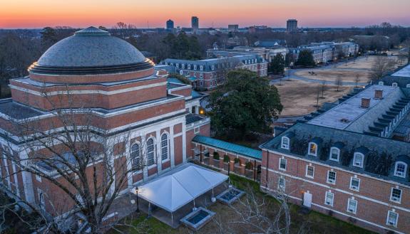 The sun rises over East Campus and downtown Durham. Photo courtesy of University Communications.