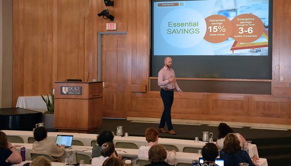 Fidelity Investments financial adviser Alan Collins talks to Financial Fitness Week participants about making a budget.