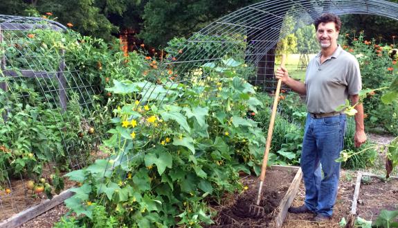 Myron Taschuk works in his home vegetable garden in Orange County.